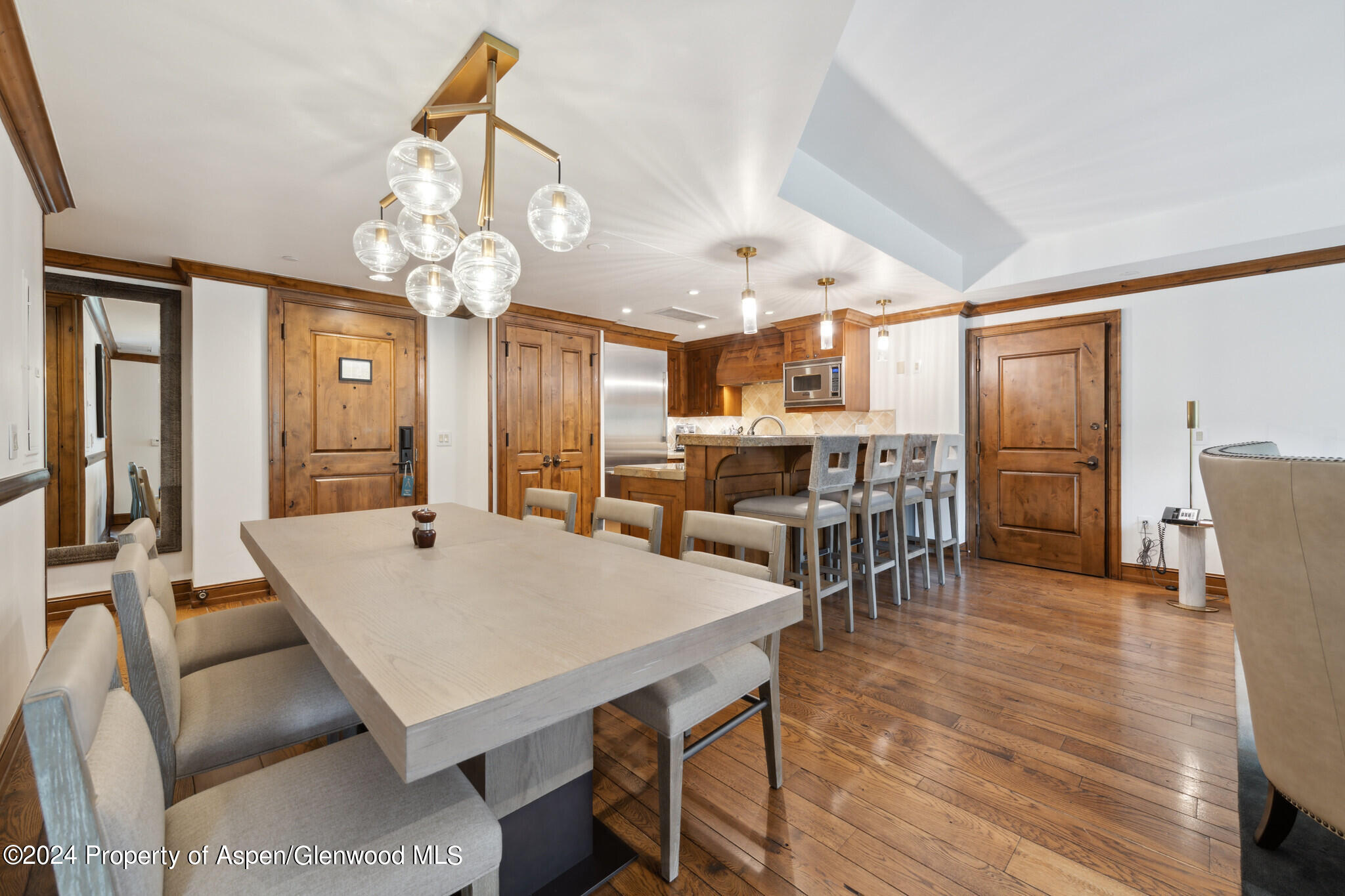 415 East Dean St Unit 22 Week 6 Aspen, CO 81611 - Photo 10 of 25 a view of a dining room with furniture and wooden floor