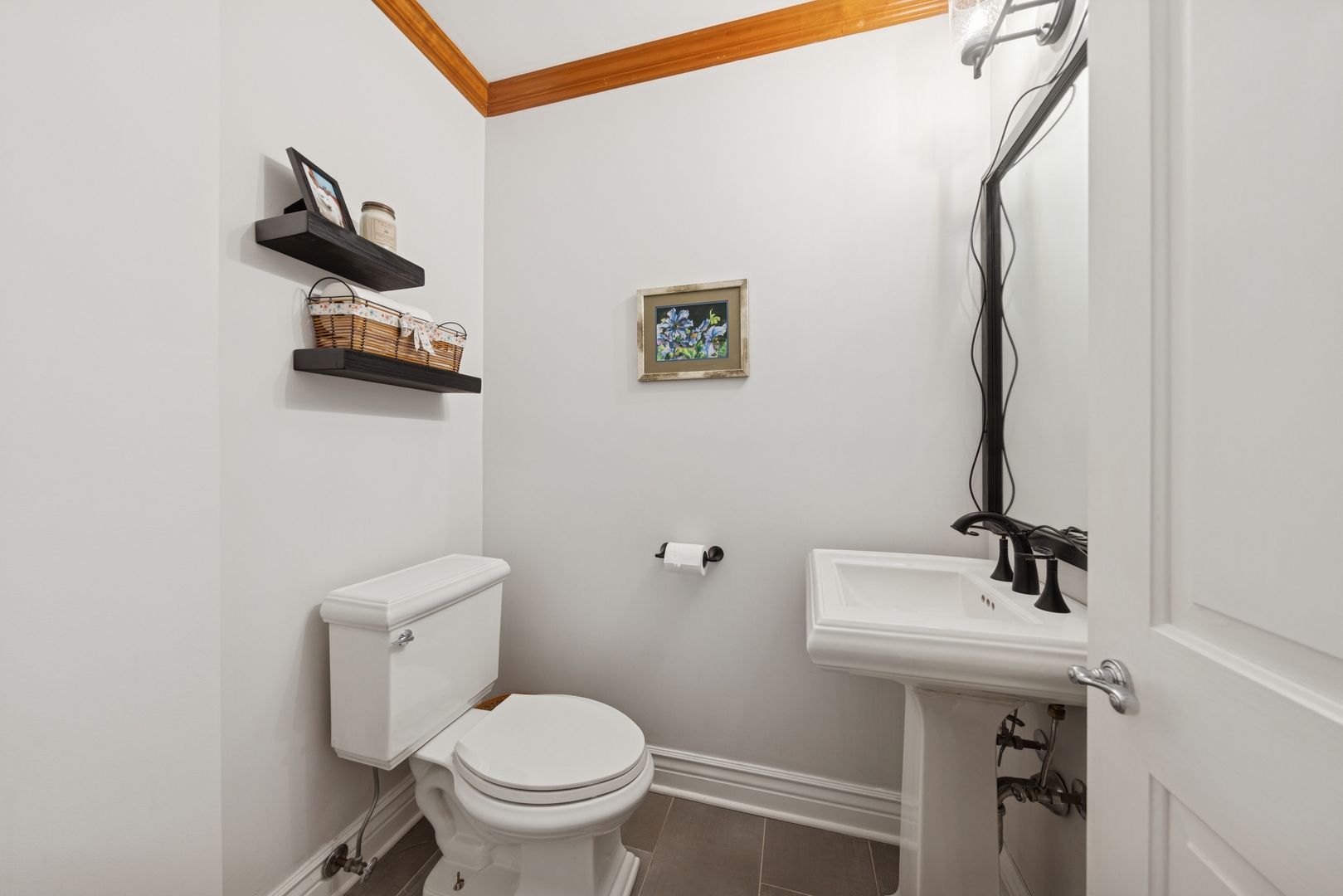 1435 Monroe Avenue River Forest, IL 60305 - Photo 12 of 38 a bathroom with a sink a toilet and a mirror