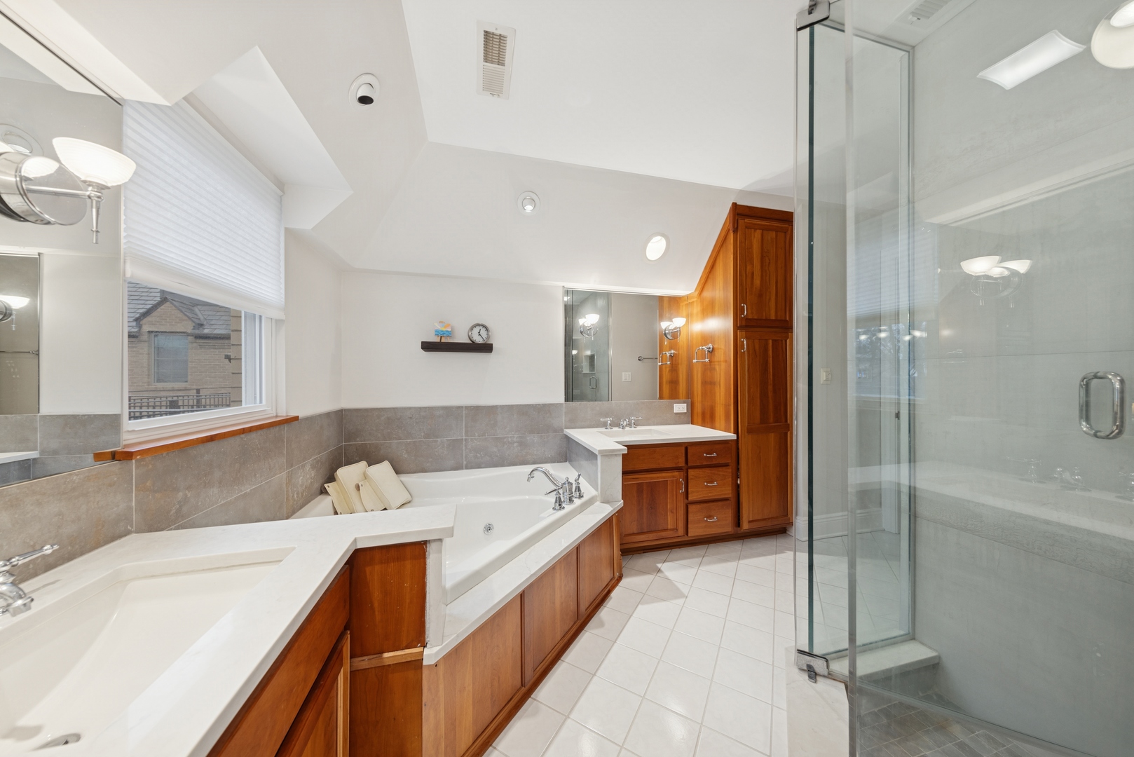 1435 Monroe Avenue River Forest, IL 60305 - Photo 16 of 38 a large bathroom with a tub a sink shower and mirror