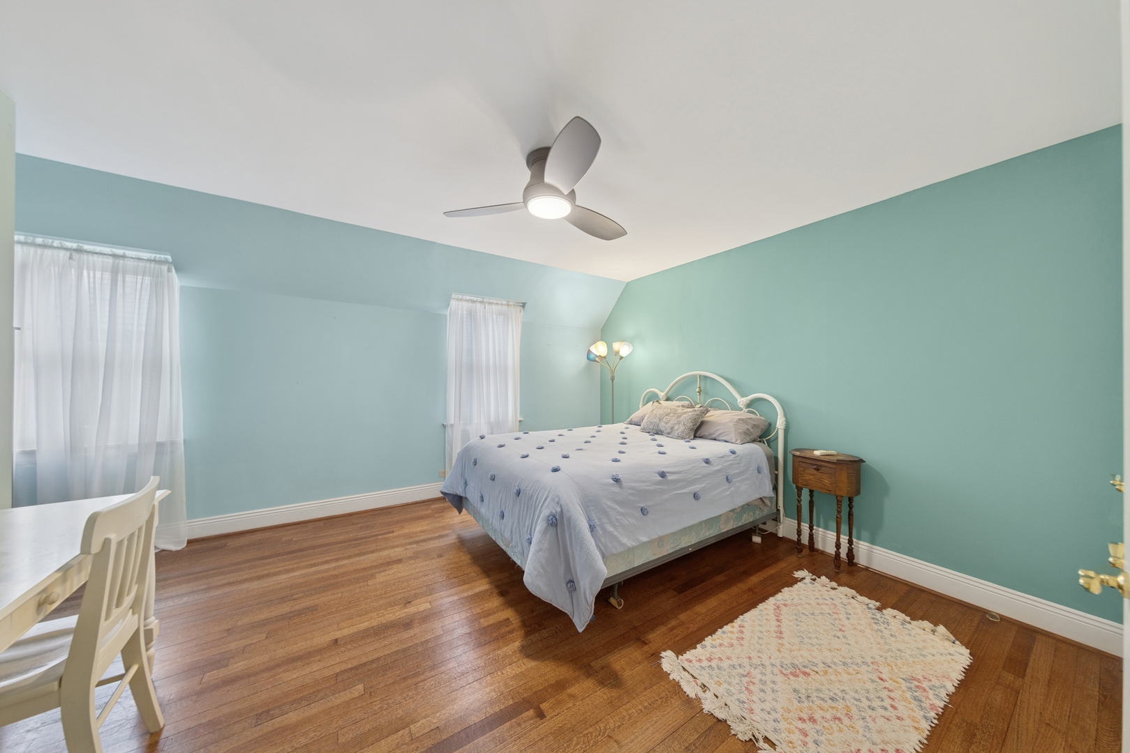 1435 Monroe Avenue River Forest, IL 60305 - Photo 17 of 38 a bedroom with a bed and wooden floor