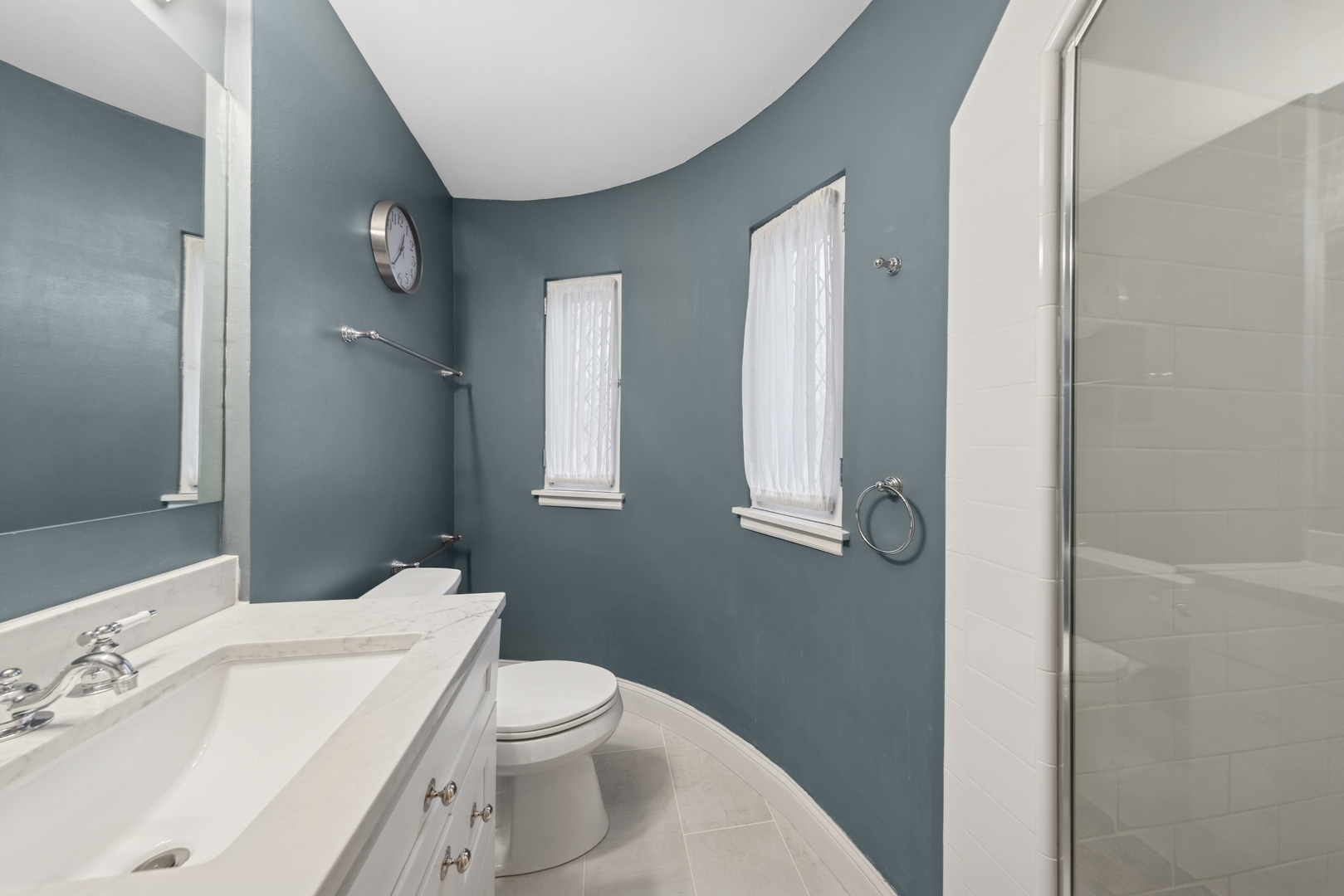 1435 Monroe Avenue River Forest, IL 60305 - Photo 20 of 38 a white toilet sitting next to a bathroom sink