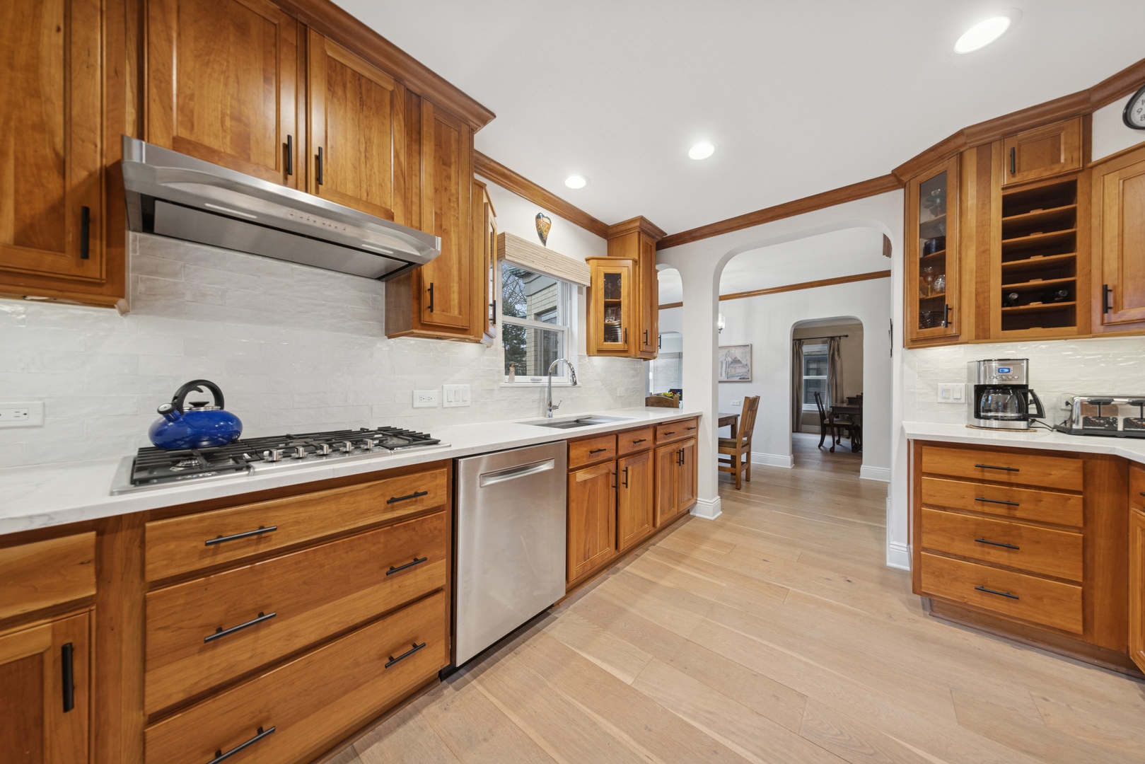 1435 Monroe Avenue River Forest, IL 60305 - Photo 8 of 38 a kitchen with stainless steel appliances granite countertop a stove and cabinets