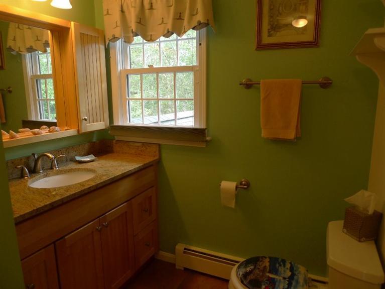 3 Princess Path East Dennis, MA 02660 - Photo 14 of 32 a bathroom with a sink and a mirror