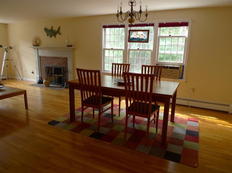 3 Princess Path East Dennis, MA 02660 - Photo 17 of 32 a view of a dining room with furniture window and wooden floor