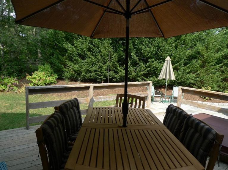 3 Princess Path East Dennis, MA 02660 - Photo 20 of 32 a view of balcony with furniture and umbrella