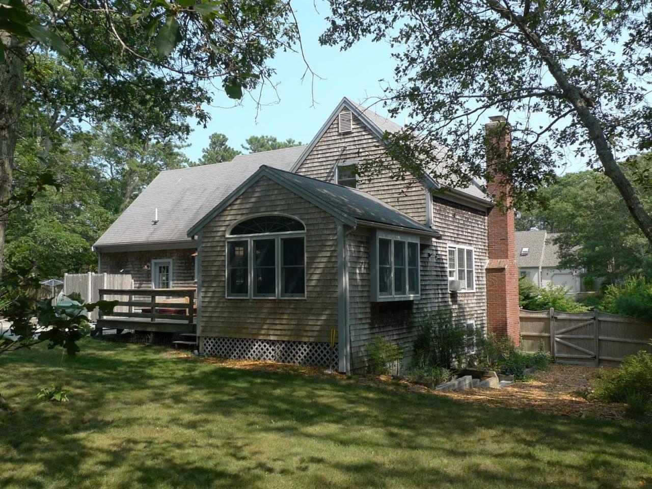 3 Princess Path East Dennis, MA 02660 - Photo 2 of 32 a front view of a house with a yard