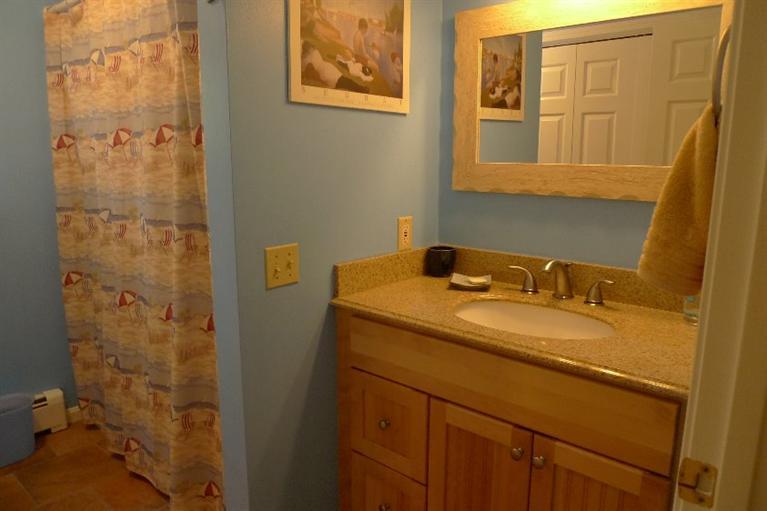 3 Princess Path East Dennis, MA 02660 - Photo 23 of 32 a bathroom with a granite countertop sink and a mirror