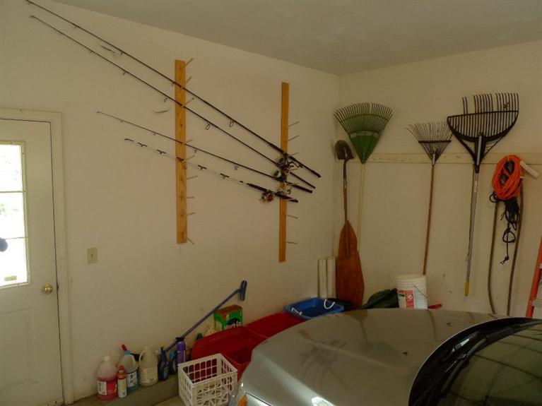 3 Princess Path East Dennis, MA 02660 - Photo 25 of 32 a bedroom with a bed and a chandelier