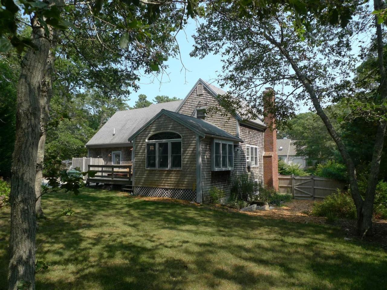 3 Princess Path East Dennis, MA 02660 - Photo 26 of 32 a front view of a house with a yard