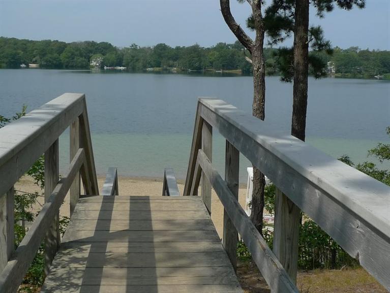 3 Princess Path East Dennis, MA 02660 - Photo 30 of 32 a view of a lake with a mountain in the background