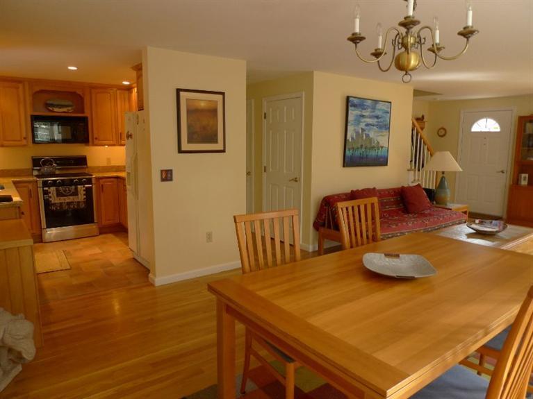 3 Princess Path East Dennis, MA 02660 - Photo 3 of 32 a view of a dining room with furniture and a chandelier