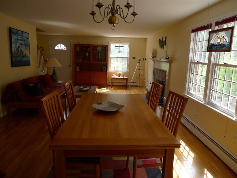 3 Princess Path East Dennis, MA 02660 - Photo 4 of 32 a view of a dining room with furniture window and wooden floor