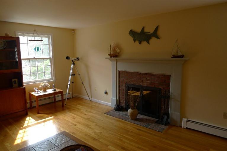 3 Princess Path East Dennis, MA 02660 - Photo 5 of 32 a living room with furniture and a fireplace