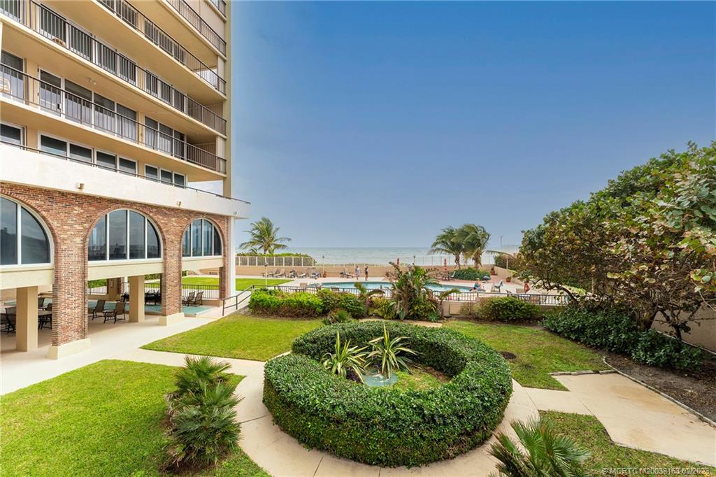 1180 South Ocean Boulevard, Unit 8B Boca Raton, FL 33432 - Photo 11 of 62 a view of a house with a yard