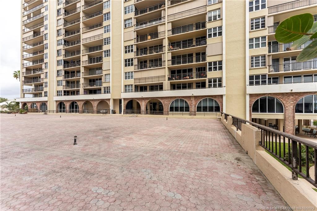 1180 South Ocean Boulevard, Unit 8B Boca Raton, FL 33432 - Photo 12 of 62 a front view of a building with large windows