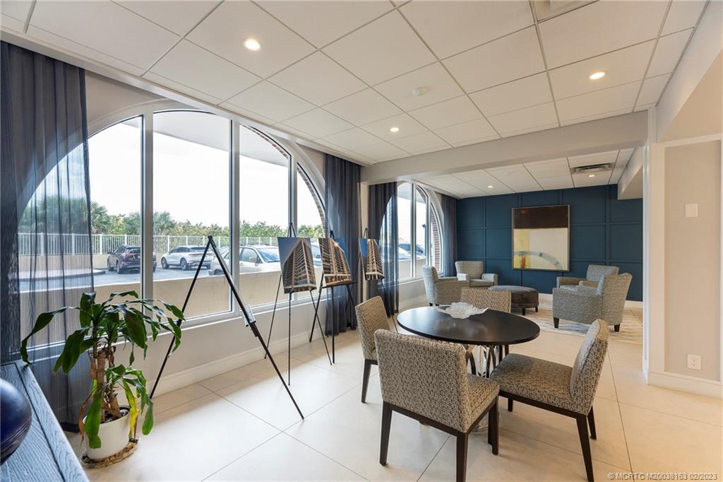 1180 South Ocean Boulevard, Unit 8B Boca Raton, FL 33432 - Photo 13 of 62 a living room with furniture and a large window
