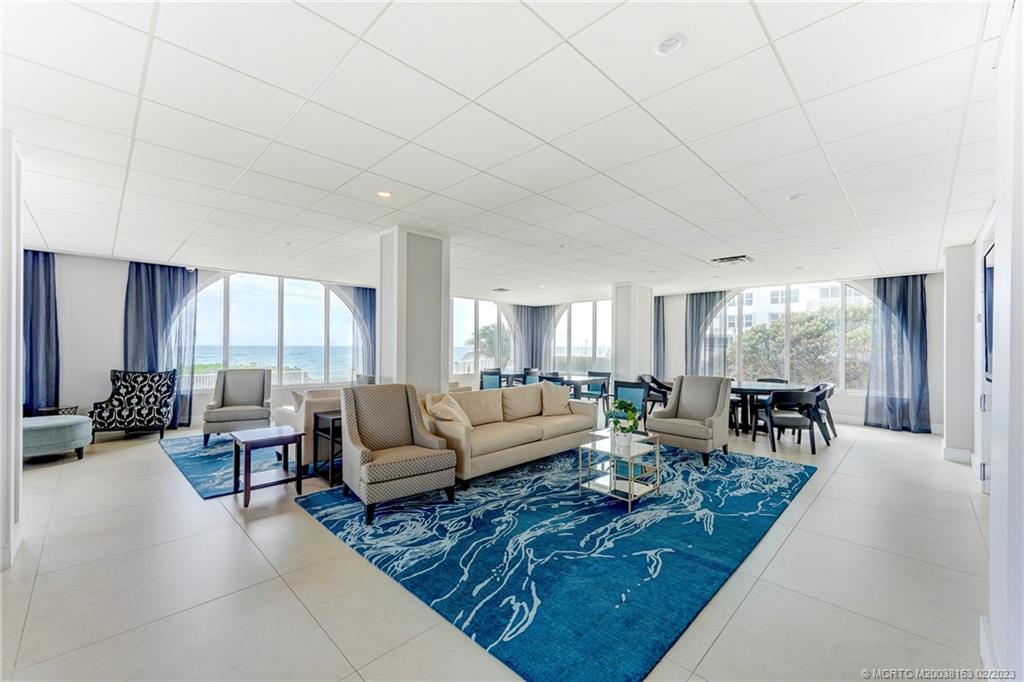 1180 South Ocean Boulevard, Unit 8B Boca Raton, FL 33432 - Photo 15 of 62 a living room with furniture and a large window