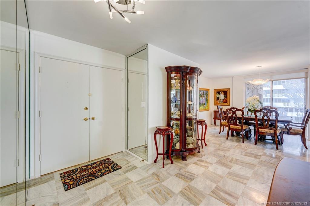 1180 South Ocean Boulevard, Unit 8B Boca Raton, FL 33432 - Photo 22 of 62 a view of a livingroom with furniture and a window