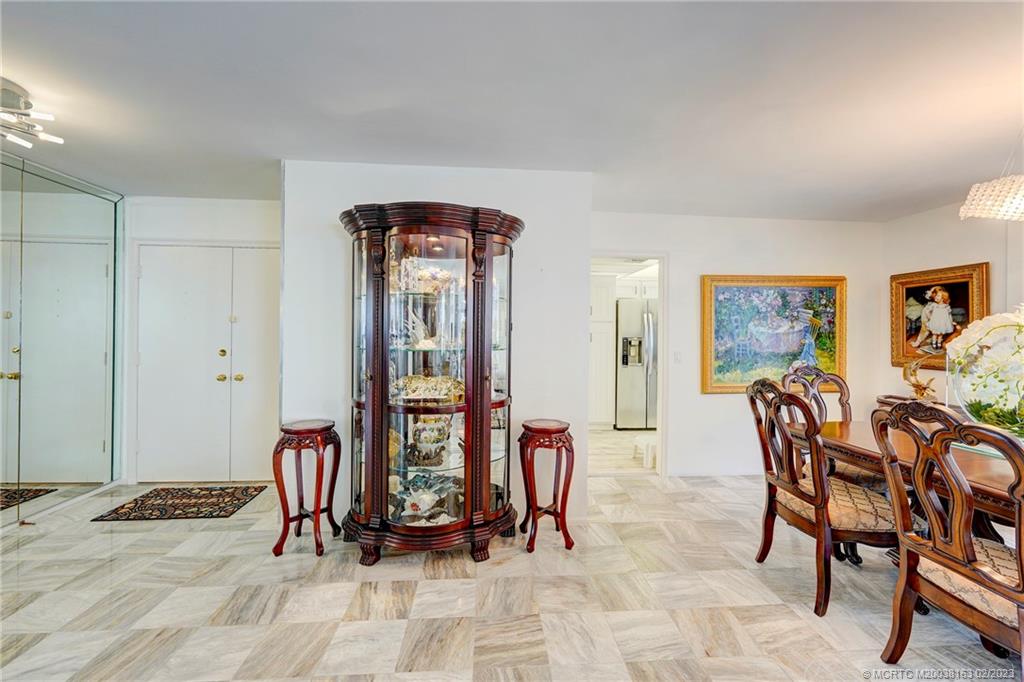 1180 South Ocean Boulevard, Unit 8B Boca Raton, FL 33432 - Photo 25 of 62 a view of a livingroom with furniture and gym equipment