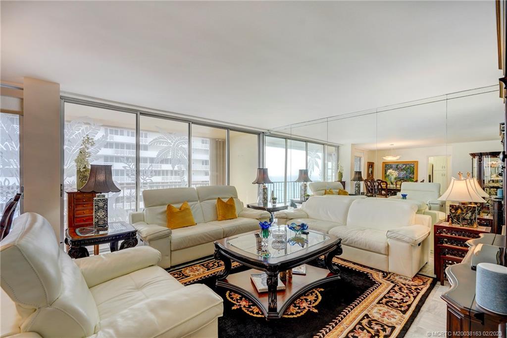 1180 South Ocean Boulevard, Unit 8B Boca Raton, FL 33432 - Photo 26 of 62 a living room with furniture and a large window
