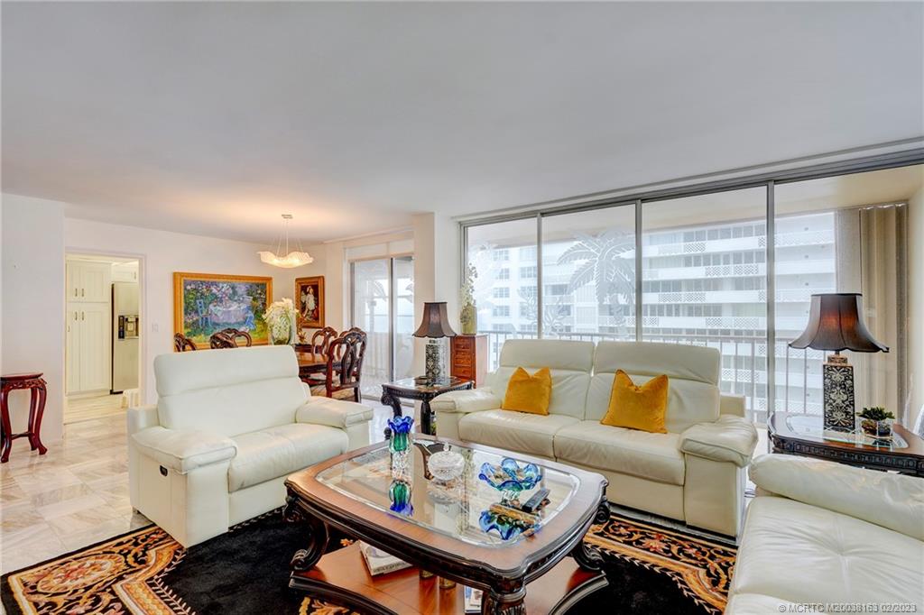 1180 South Ocean Boulevard, Unit 8B Boca Raton, FL 33432 - Photo 27 of 62 a living room with furniture and a large window