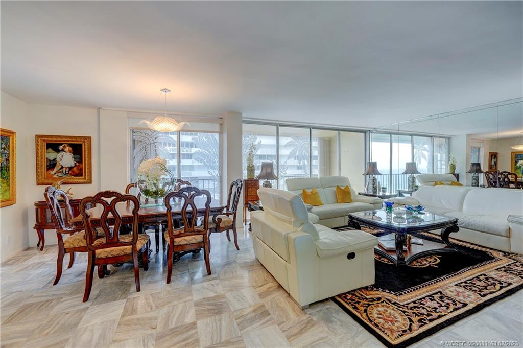 1180 South Ocean Boulevard, Unit 8B Boca Raton, FL 33432 - Photo 29 of 62 a living room with furniture and a large window