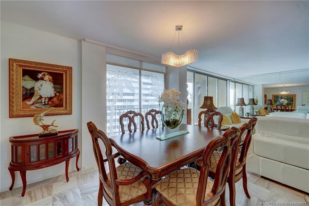 1180 South Ocean Boulevard, Unit 8B Boca Raton, FL 33432 - Photo 30 of 62 a view of a dining room with furniture window and wooden floor