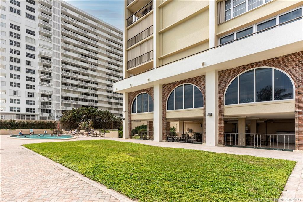 1180 South Ocean Boulevard, Unit 8B Boca Raton, FL 33432 - Photo 3 of 62 a view of a building with a yard