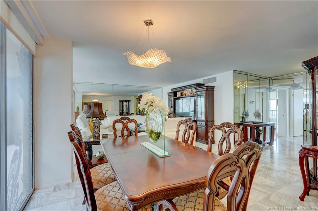 1180 South Ocean Boulevard, Unit 8B Boca Raton, FL 33432 - Photo 32 of 62 a view of a dining room with furniture