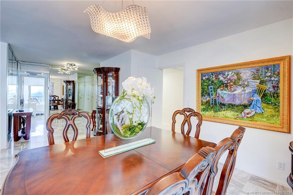 1180 South Ocean Boulevard, Unit 8B Boca Raton, FL 33432 - Photo 33 of 62 a dining room filled with furniture and furniture