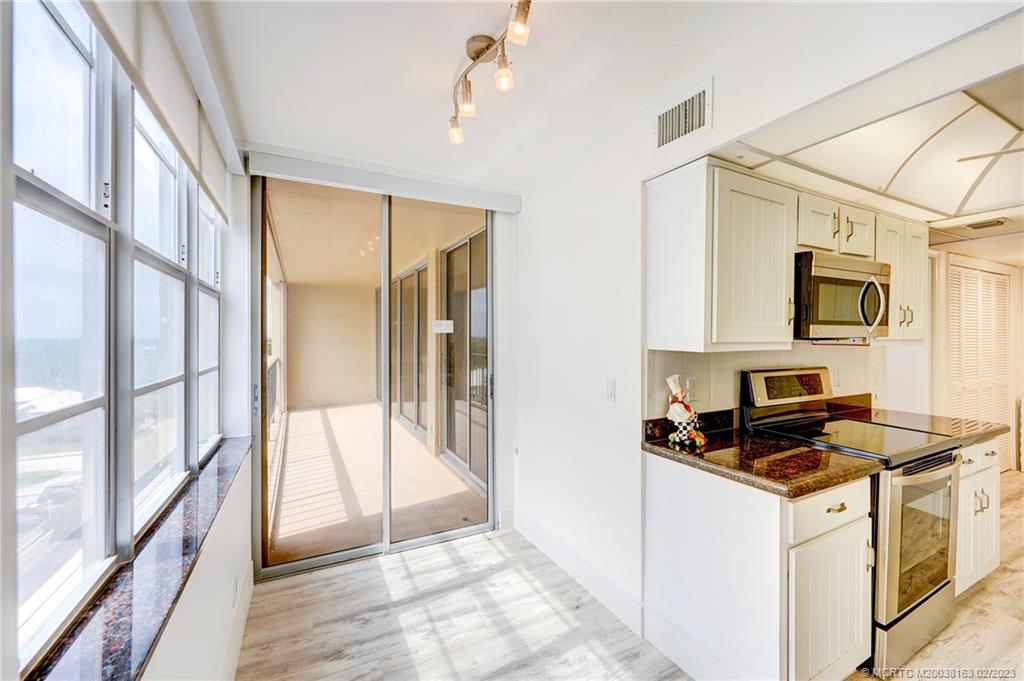 1180 South Ocean Boulevard, Unit 8B Boca Raton, FL 33432 - Photo 36 of 62 a view of kitchen with sink and refrigerator