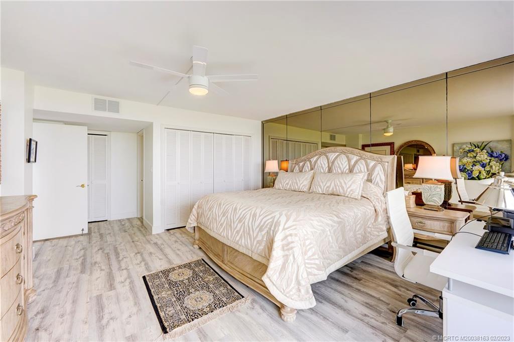 1180 South Ocean Boulevard, Unit 8B Boca Raton, FL 33432 - Photo 43 of 62 a bedroom with a bed and a walk in closet