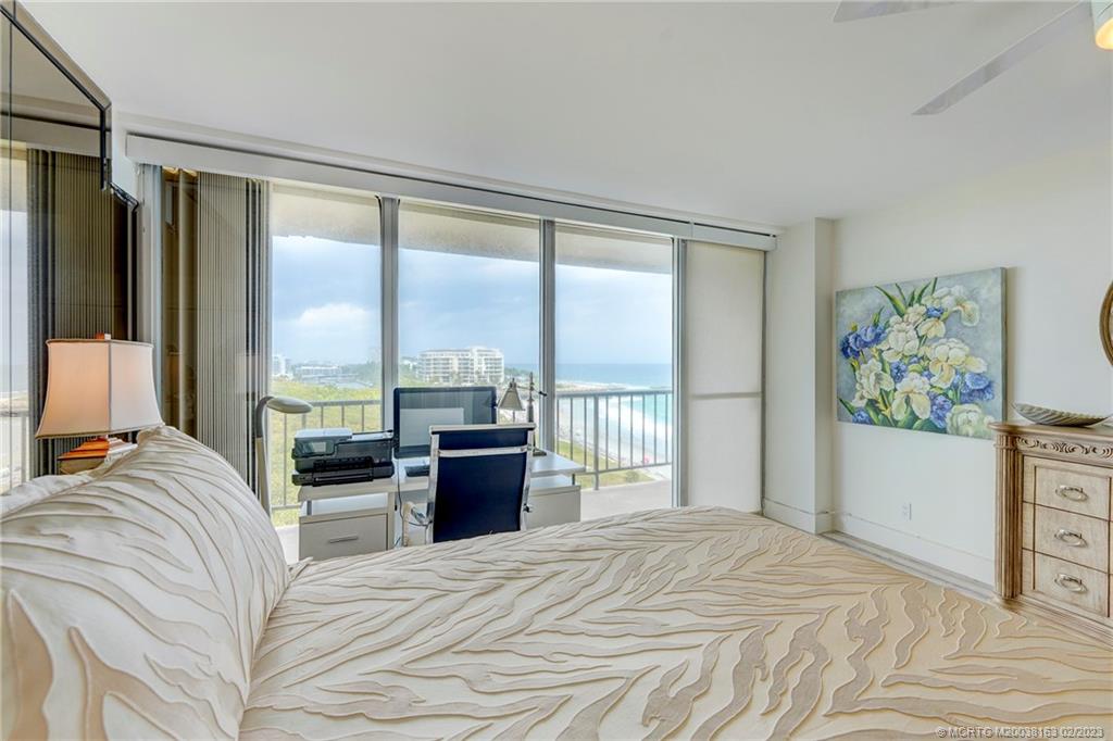 1180 South Ocean Boulevard, Unit 8B Boca Raton, FL 33432 - Photo 48 of 62 a bedroom with a bed and a dresser next to a window