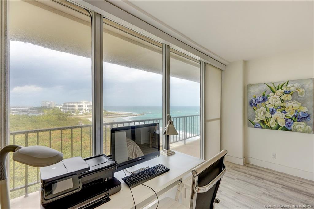 1180 South Ocean Boulevard, Unit 8B Boca Raton, FL 33432 - Photo 50 of 62 a living room with furniture and a floor to ceiling window