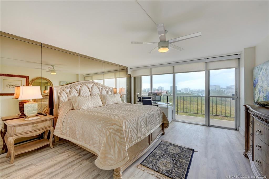 1180 South Ocean Boulevard, Unit 8B Boca Raton, FL 33432 - Photo 53 of 62 a bedroom with a large bed and a balcony view