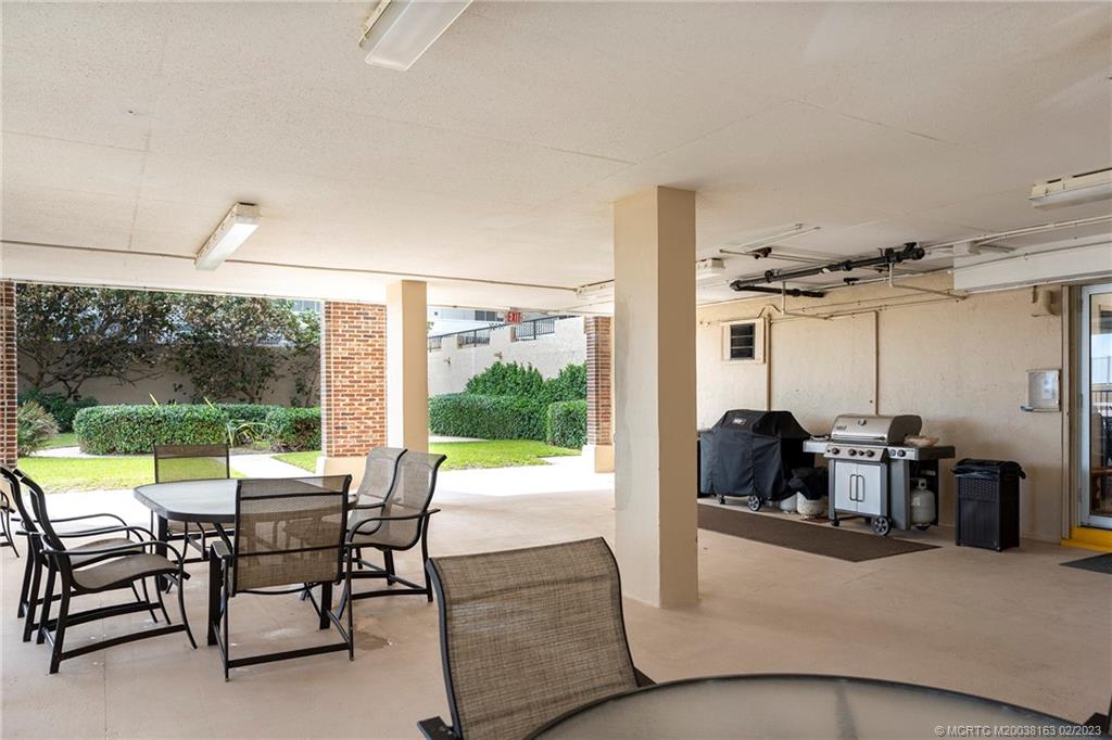 1180 South Ocean Boulevard, Unit 8B Boca Raton, FL 33432 - Photo 10 of 62 a living room with furniture and a large window