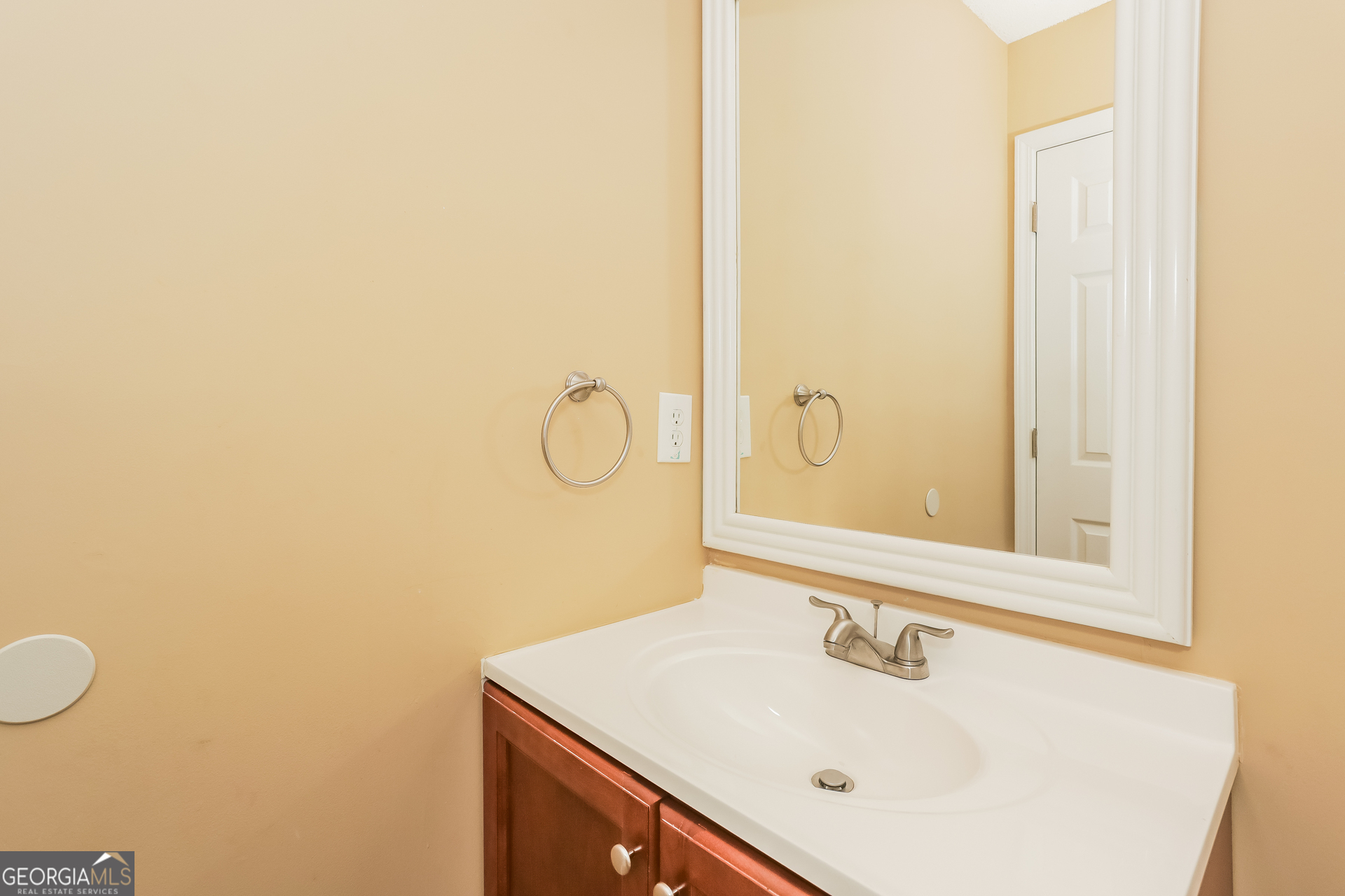 5002 Serenity Point Lane Villa Rica, GA 30180 - Photo 13 of 17 a bathroom with a sink and a mirror