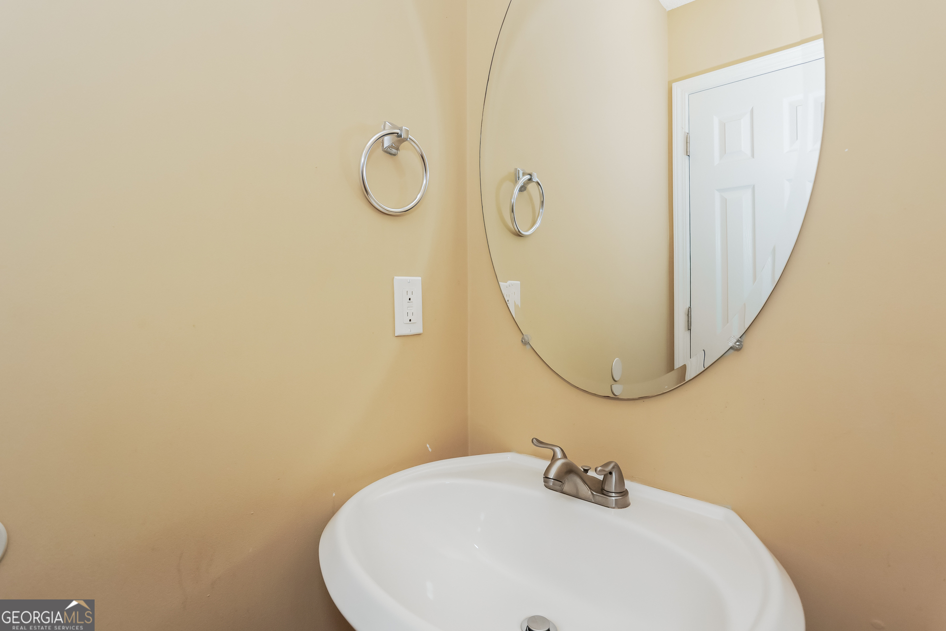 5002 Serenity Point Lane Villa Rica, GA 30180 - Photo 14 of 17 a bathroom with a sink and mirror
