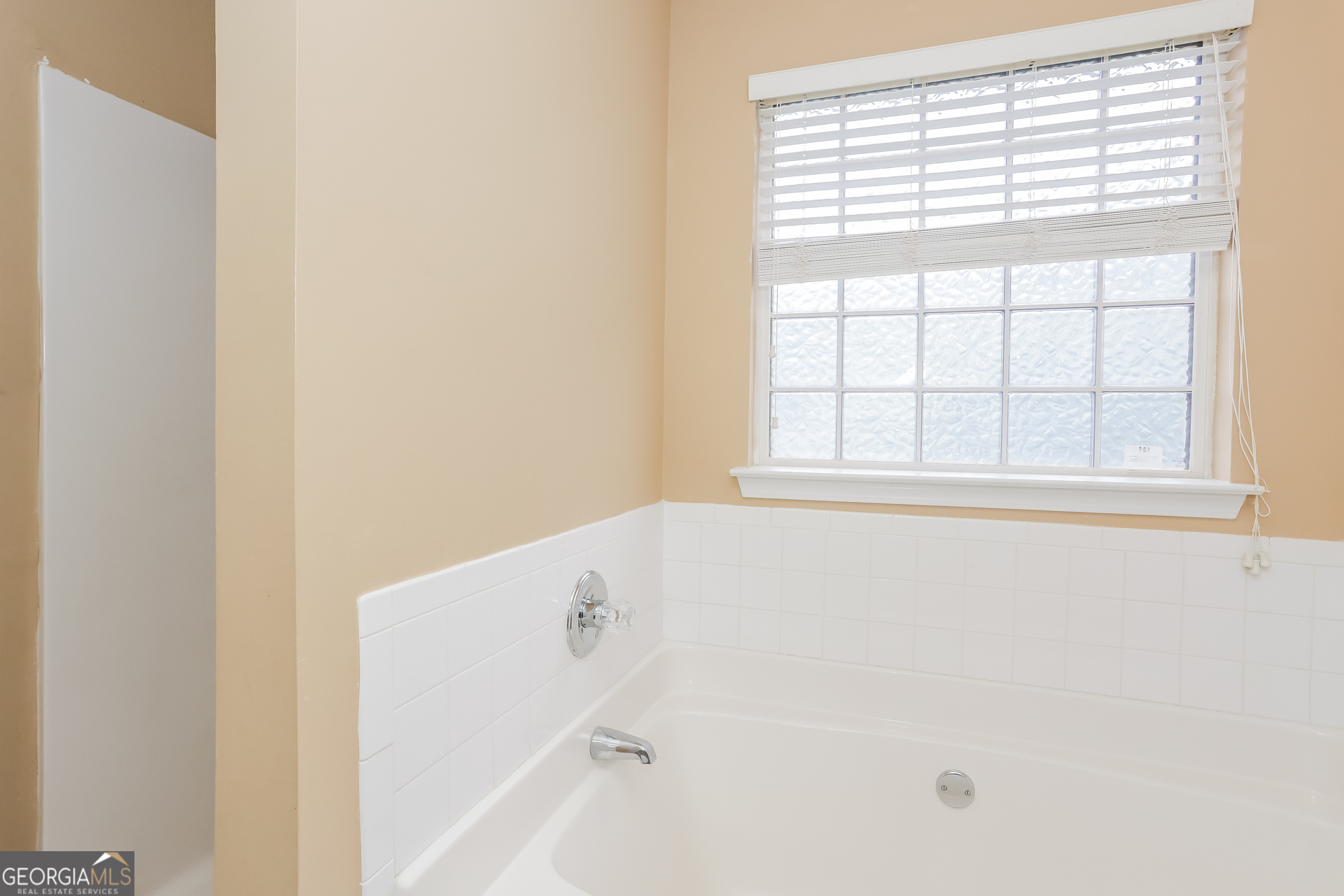 5002 Serenity Point Lane Villa Rica, GA 30180 - Photo 9 of 17 a view of an empty room with a window