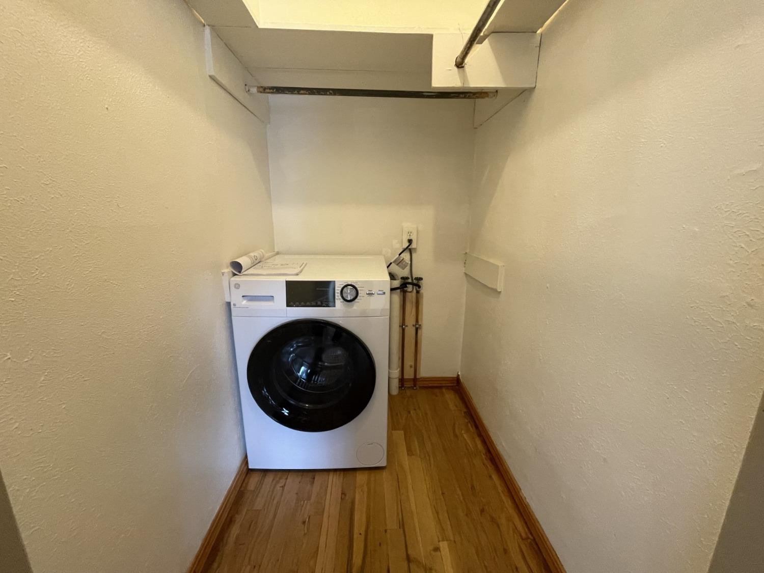 3018 29th Street Lubbock, TX 79410 - Photo 14 of 14 a utility room with dryer and washer