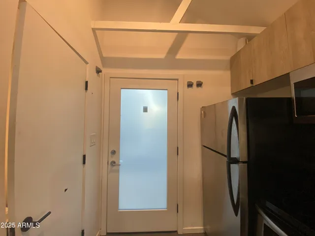 a view of a refrigerator in kitchen