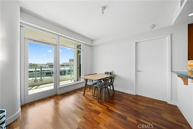 a room with a bed a table and chairs