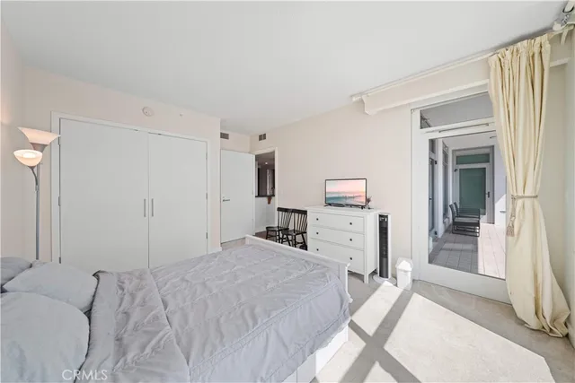 a bedroom with a bed and a fireplace