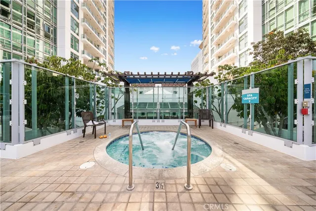a view of a patio with dining table and chairs