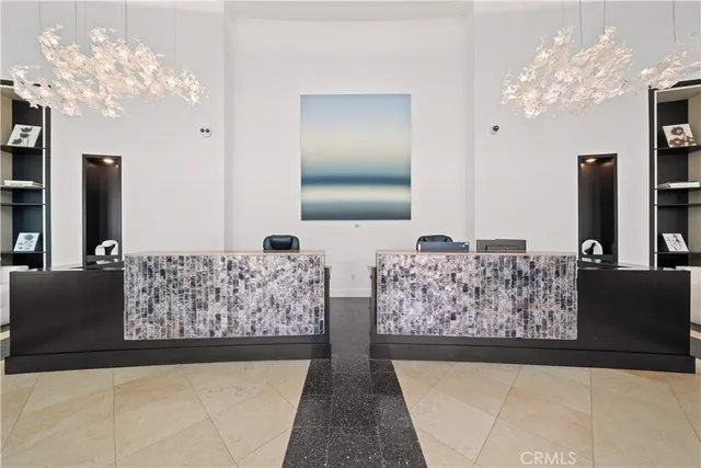 a view of kitchen with furniture and refrigerator