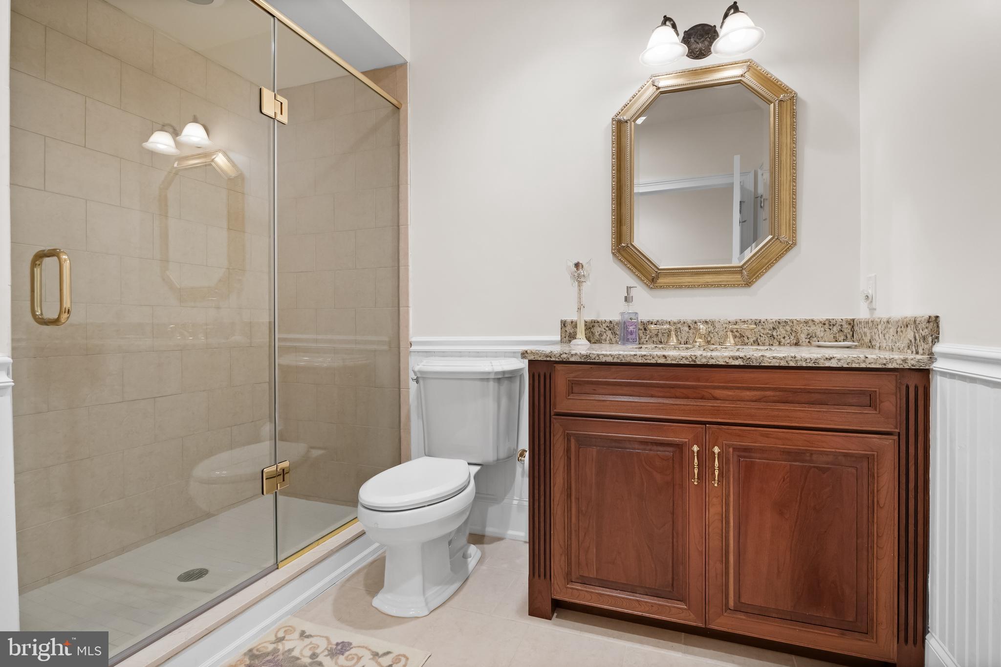 124 Bainbridge Street Philadelphia, PA 19147 - Photo 37 of 53 a bathroom with a granite countertop toilet sink mirror and vanity