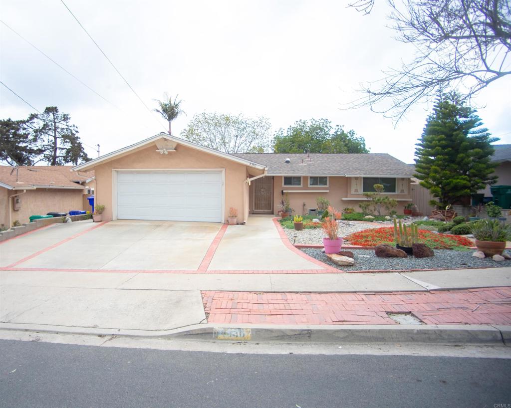 4380 Rolfe Road San Diego, CA 92117 - Photo 1 of 1 a front view of a house with a yard and garage
