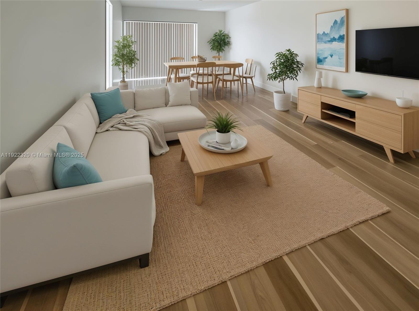 8700 Sherman Circle North, Unit 501 Miramar, FL 33025 - Photo 1 of 14 a living room with furniture and a flat screen tv