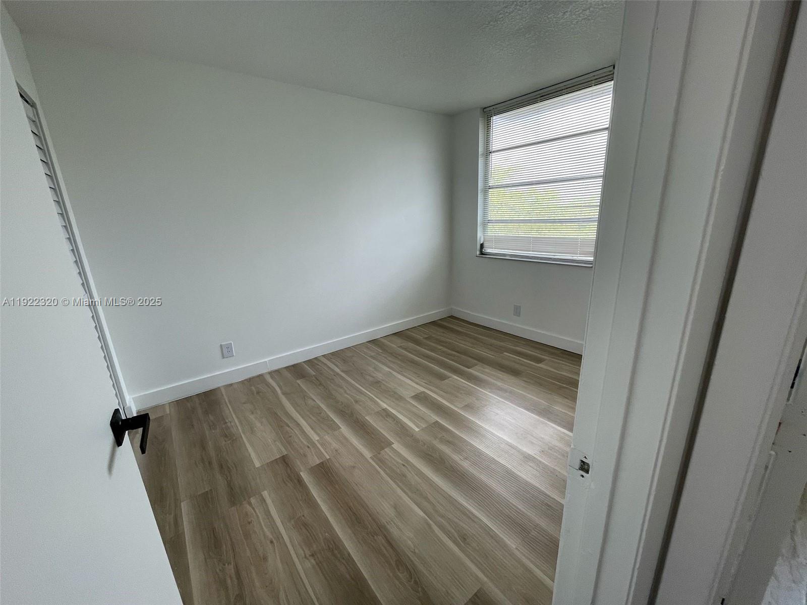 8700 Sherman Circle North, Unit 501 Miramar, FL 33025 - Photo 11 of 14 a view of empty room with window