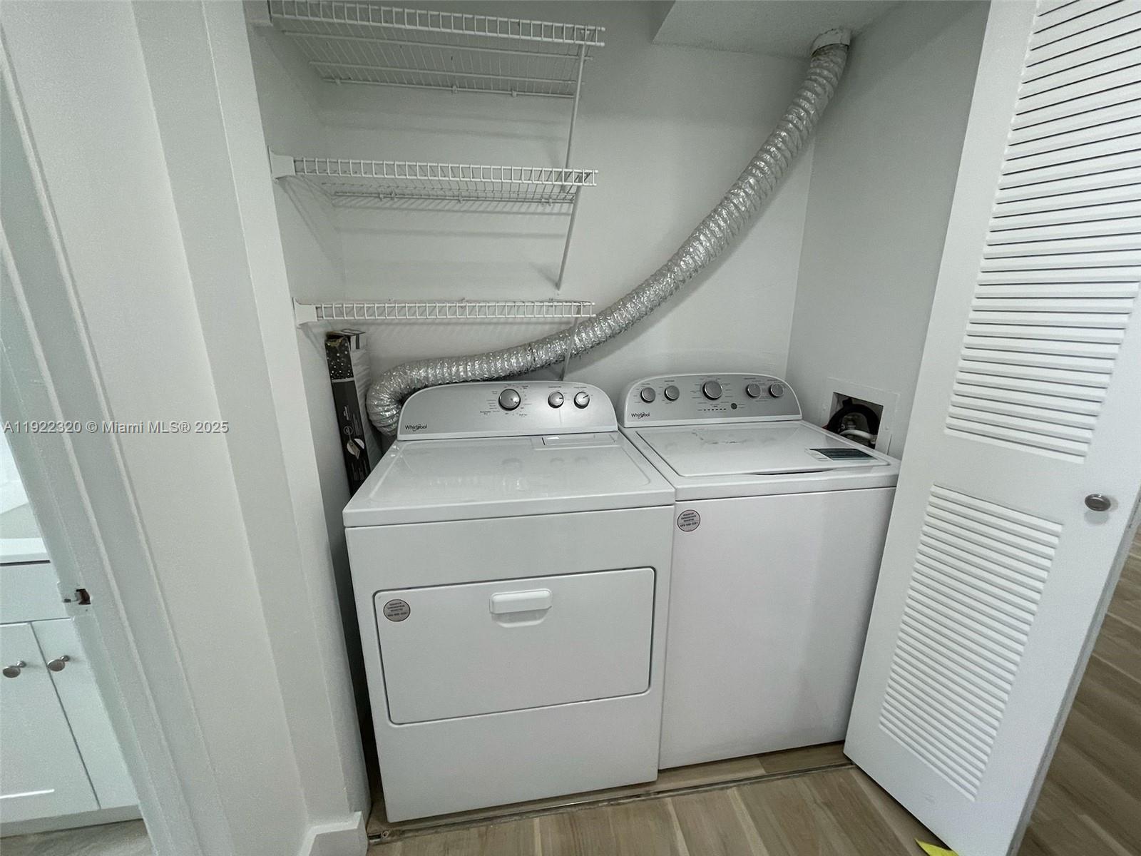 8700 Sherman Circle North, Unit 501 Miramar, FL 33025 - Photo 10 of 14 a utility room with dryer and washer